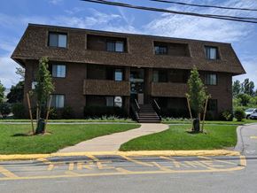 Revere apartment for rent - a brick apartment building with a sidewalk in front of it
