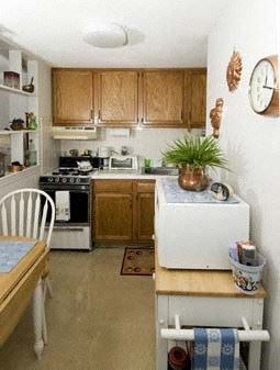 Nashua apartment for rent - a small kitchen with a table and a refrigerator