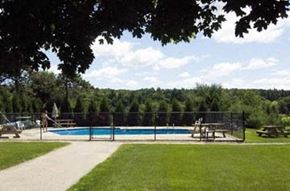 Keene apartment for rent - a swimming pool with trees in the background