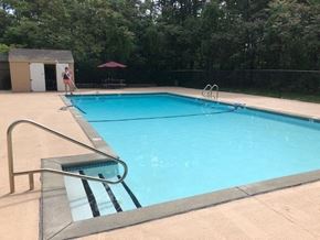 Mansfield apartment for rent - a swimming pool with a person standing next to it