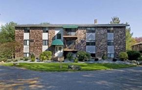 Foxboro apartment for rent - the front of a brick building with a green roof