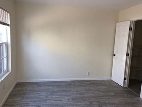 Alameda apartment for rent - A room with a white door and a window.