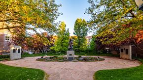 Salt Lake City apartment for rent - Statue in a flower area outside of First Avenue Homes