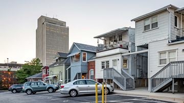 Salt Lake City apartment for rent - a city street with cars parked in front of buildings