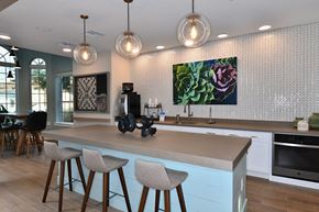 Jacksonville apartment for rent - A kitchen with a counter and bar stools.