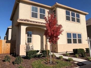 Modesto house for rent - a house with a red tree in front of it