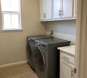 Modesto house for rent - a small laundry room with a washing machine and a sink