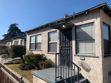 Montebello apartment for rent - an old house with a staircase in front of it