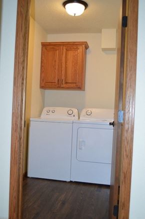 Mandan apartment for rent - a laundry room with a washer and dryer in it