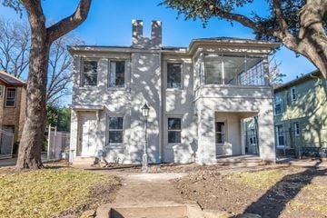 Dallas apartment for rent - an old with trees in front of it