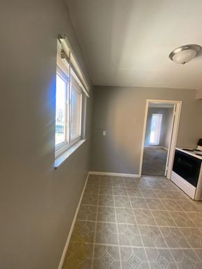 Cincinnati apartment for rent - A room with a tiled floor and a window letting in sunlight.