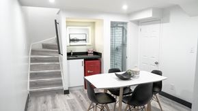 Toronto apartment for rent - A dining room with a white table and chairs.