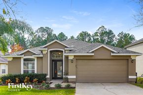 St Augustine house for rent - A house with a brown garage door is for sale.