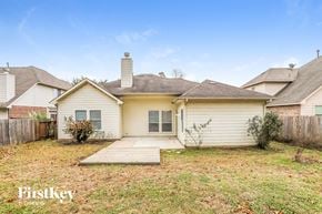 Magnolia house for rent - a small white house with a yard and a wooden walkway