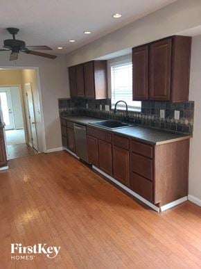 Hamilton house for rent - an empty kitchen with a sink and wooden floors