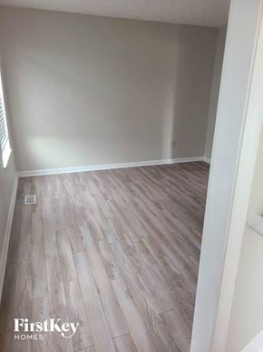Hamilton house for rent - a room with wooden flooring in a room