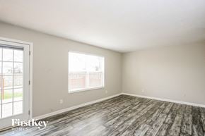 Avon house for rent - the spacious living room with wood flooring and a window