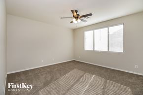 San Tan Valley house for rent - the spacious living room with ceiling fan and window