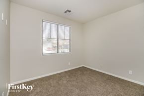 San Tan Valley house for rent - a spacious room with carpet and a window