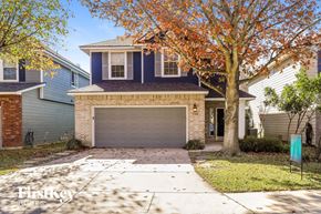 San Antonio house for rent - a house with a driveway and a garage door