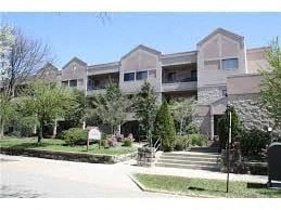 Oakmont apartment for rent - an apartment building with trees and bushes in front of it