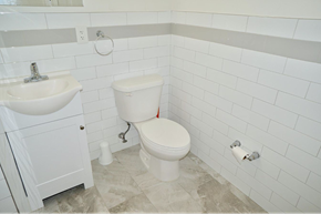 Elizabeth apartment for rent - a white bathroom with a toilet and a sink