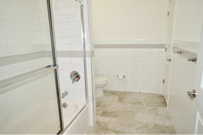 Elizabeth apartment for rent - a white bathroom with a shower and a toilet