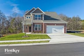 Kernersville house for rent - a brick house with a white garage door and a lawn