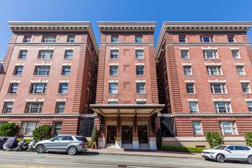 San Francisco apartment for rent - A red brick building with a car parked in front.