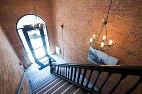 Toronto apartment for rent - a staircase with a large window and a chandelier