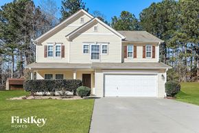Dallas house for rent - a white house with a white garage door