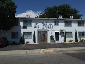 Albuquerque apartment for rent - A white building with the word "Plata" written on it.