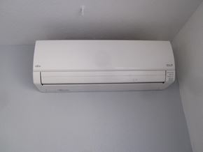 Albuquerque apartment for rent - A white air conditioner is mounted on a white wall.