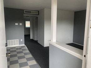 Albuquerque apartment for rent - A room with a checkered floor and a window.
