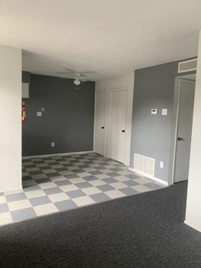 Albuquerque apartment for rent - A room with a checkered floor and a ceiling fan.