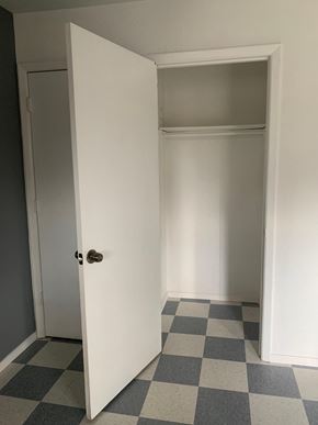 Albuquerque apartment for rent - A white door is open to a room with a checkered floor.