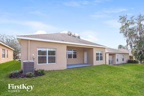 Valrico house for rent - A house with a brown roof and a beige exterior is for sale.