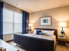 Miamisburg apartment for rent - a bedroom with a bed and a window