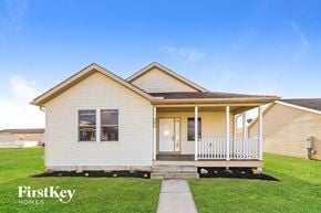 Commercial Point house for rent - A small house with a porch and a front door is for sale.