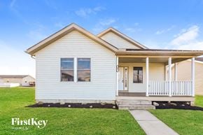 Commercial Point house for rent - A small, single-story house with a porch and a front yard.
