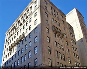 Philadelphia apartment for rent - a tall building with a lot of windows and a blue sky