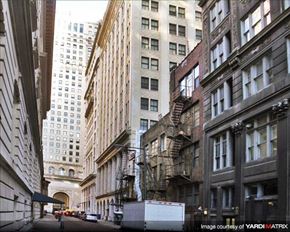 Philadelphia apartment for rent - a city street with tall buildings  and a truck
