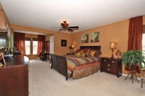 Morrow house for rent - a bedroom with a bed and a ceiling fan