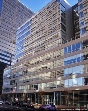Philadelphia apartment for rent - a tall building with cars parked in front of it
