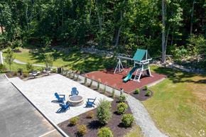 Boylston apartment for rent - a backyard with a playground and a picnic table