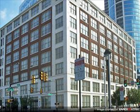 Philadelphia apartment for rent - a large building on a city street with traffic lights