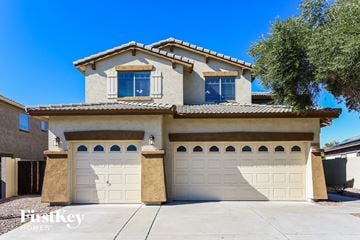 Surprise house for rent - a house with two garage doors in front of it