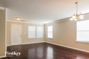 Atlanta house for rent - the dining room of an empty house with a chandelier