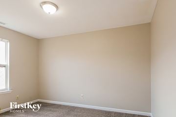 Atlanta house for rent - the living room of a new home with white walls and carpet