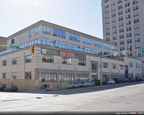 Baltimore apartment for rent - a large building on the corner of a city street
